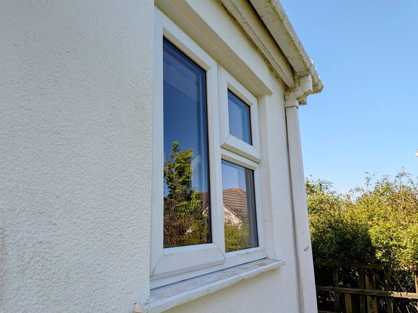 Fascia and soffit clean — pure-water reach